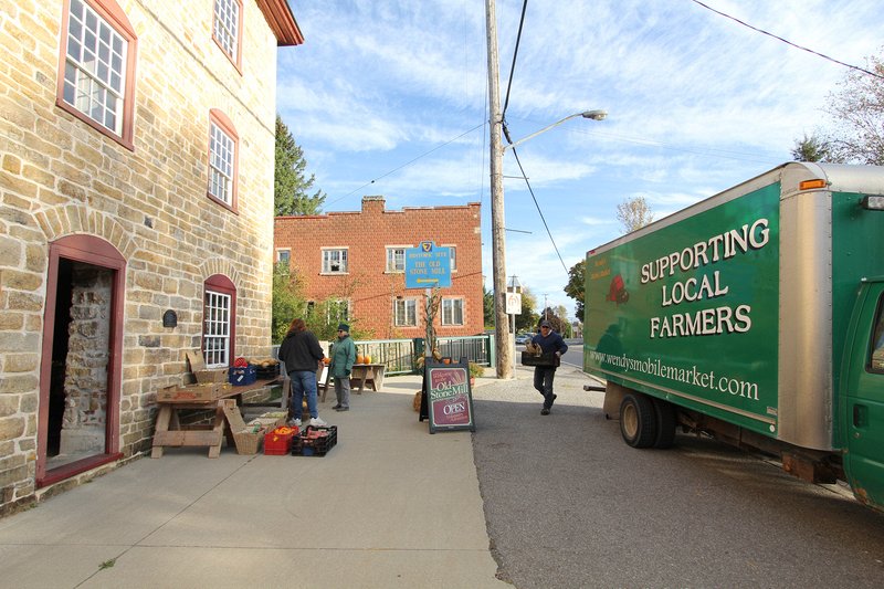 One of our vendors, Wendy's Market, sets up in front of the mill.  Delta Harvest Festival 2015