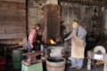 Blacksmiths Amanda Van Bruggen and Rory MacKay work the forge.  Delta Harvest Festival 2015