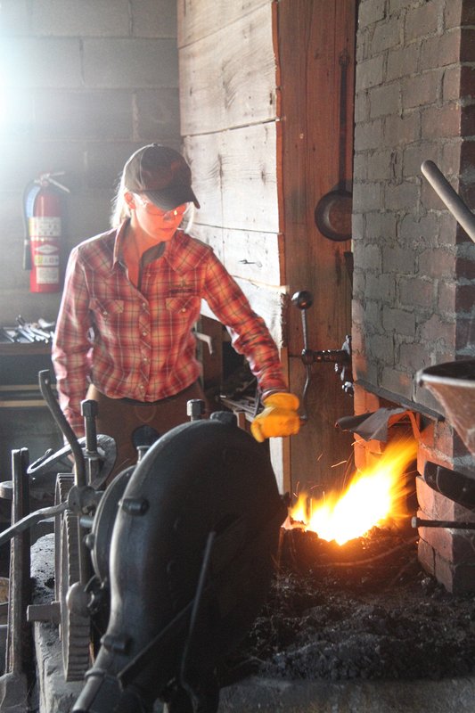 Blacksmith Amanda Van Bruggen works the forge.  Delta Harvest Festival 2015