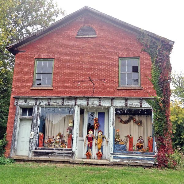 Nancy Penstone's family of scarecrows, as seen guarding the Old Apron Factory, earned her a gift bag of goodies donated by the Delta Mill Society.