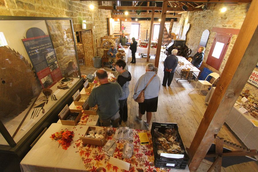 Vendors with fall goodies in the turbine shed of the Old Stone Mill