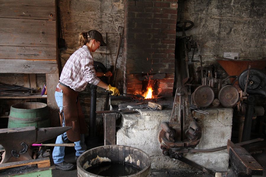 Blacksmith Amanda Van Bruggen works the forge