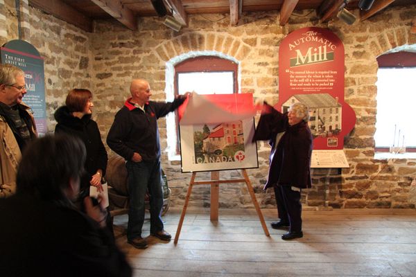 And finally - Art Cowan, President of the Delta Mill Society and Mary Freiday, director, DMS, unveil the stamp (a very large representation of it).